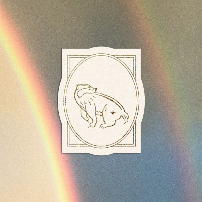 Whimsical badger illustration card layered over a rainbow sky - representing ‘Within’ category for spiritual growth tools and resources